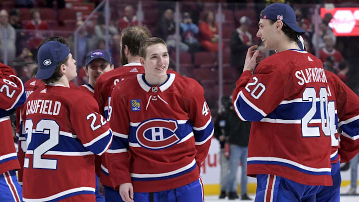 Apr 16, 2024; Montreal, Quebec, CAN; Montreal Canadiens forward Cole Caufield (22) and teammates defenseman Lane Hutson (48) and forward Juraj Slafkovsky (20) after a game against the Detroit Red Wings at the Bell Centre. Mandatory Credit: Eric Bolte-Imagn Images Apr 16, 2024; Montreal, Quebec, CAN; Montreal Canadiens forward Cole Caufield (22) and teammates defenseman Lane Hutson (48) and forward Juraj Slafkovsky (20) after a game against the Detroit Red Wings at the Bell Centre. Mandatory Credit: Eric Bolte-Imagn Images