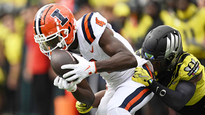 Oct 26, 2024; Eugene, Oregon, USA; Illinois Fighting Illini wide receiver Zakhari Franklin (4) catches a pass for a first down during the second half against Oregon Ducks defensive back Jabbar Muhammad (7) at Autzen Stadium. Mandatory Credit: Troy Wayrynen-Imagn Images Oct 26, 2024; Eugene, Oregon, USA; Illinois Fighting Illini wide receiver Zakhari Franklin (4) catches a pass for a first down during the second half against Oregon Ducks defensive back Jabbar Muhammad (7) at Autzen Stadium. Mandatory Credit: Troy Wayrynen-Imagn Images