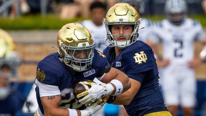 Sep 12, 2026; South Bend, Indiana, USA; Notre Dame Fighting Irish quarterback CJ Carr (13) hands off to running back Aneyas Williams (22) against the Rice Owls during the first half at Notre Dame Stadium. Sep 12, 2026; South Bend, Indiana, USA; Notre Dame Fighting Irish quarterback CJ Carr (13) hands off to running back Aneyas Williams (22) against the Rice Owls during the first half at Notre Dame Stadium.