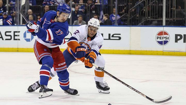 Sep 22, 2026; New York, New York, USA; New York Rangers right wing Eeli Tolvanen (17) and New York Islanders defenseman Kashawn Aitcheson (37) battle for control of the puck in the second period at Madison Square Garden. Mandatory Credit: Wendell Cruz-Imagn Images Sep 22, 2026; New York, New York, USA; New York Rangers right wing Eeli Tolvanen (17) and New York Islanders defenseman Kashawn Aitcheson (37) battle for control of the puck in the second period at Madison Square Garden. Mandatory Credit: Wendell Cruz-Imagn Images