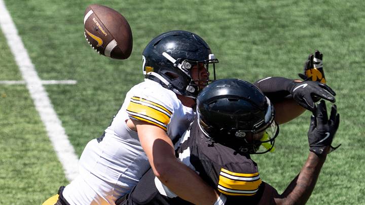 Iowa lineback Derek Weisskopf (22) defends a pass to running back O’Lontae Dean (15) April 25, 2026 during the team’s spring practice at Kinnick Stadium in Iowa City, Iowa.