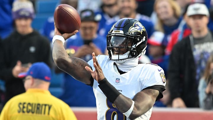 Baltimore Ravens quarterback Lamar Jackson warms up prior to the game against the Buffalo Bills at Highmark Stadium. 