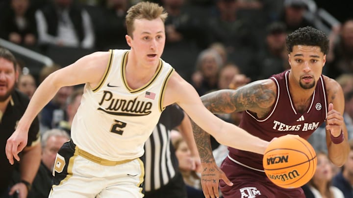 Purdue Boilermakers guard Fletcher Loyer (2) steals the ball from Texas A&M Aggies guard Jace Carter (0) 