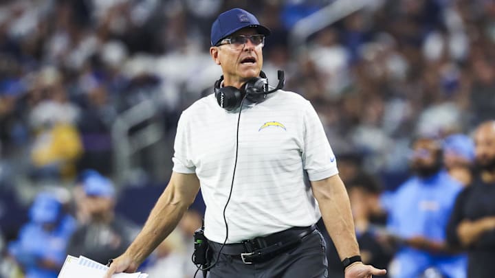 Dec 21, 2025; Arlington, Texas, USA; Los Angeles Chargers head coach Jim Harbaugh reacts to a play against the Dallas Cowboys during the first half at AT&T Stadium. Mandatory Credit: Kevin Jairaj-Imagn Images
