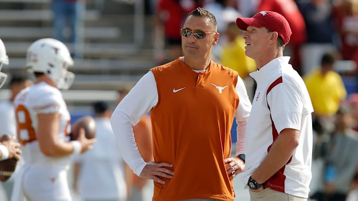 Oklahoma head coach Brent Venables, at right, and Texas head coach Steve Sarkisian