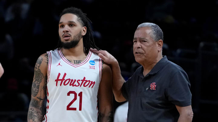 Houston guard Emanuel Sharp talks to coach Kelvin Sampson.