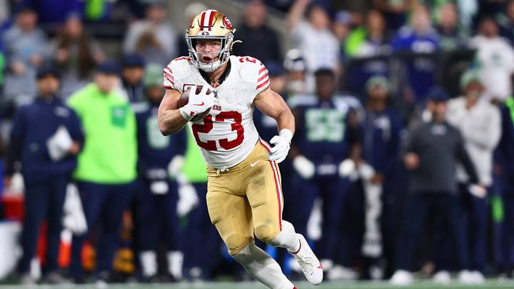 San Francisco 49ers running back Christian McCaffrey (23) runs after the catch against the Seattle Seahawks during the first half in an NFC Divisional Round game at Lumen Field. San Francisco 49ers running back Christian McCaffrey (23) runs after the catch against the Seattle Seahawks during the first half in an NFC Divisional Round game at Lumen Field.