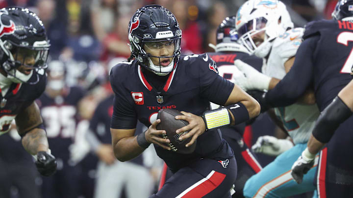 Dec 15, 2024; Houston, Texas, USA; Houston Texans quarterback C.J. Stroud (7) rolls out on a play during the game against the Miami Dolphins at NRG Stadium. Mandatory Credit: Troy Taormina-Imagn Images