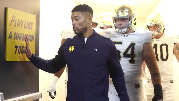 Nov 15, 2025; Pittsburgh, Pennsylvania, USA;  Notre Dame Fighting Irish head coach Marcus Freeman leads the team from the locker room to play the Pittsburgh Panthers at Acrisure Stadium. Mandatory Credit: Charles LeClaire-Imagn Images