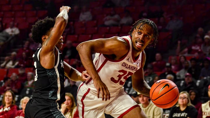 Oklahoma forward Derrion Reid dribbles against Stetson.