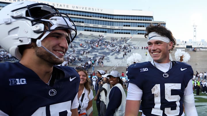 Penn State Nittany Lions quarterbacks Ethan Grunkemeyer (17) and Drew Allar (15) share a moment together following their 46-11 win over the Nevada Wolf Pack at Beaver Stadium. 
