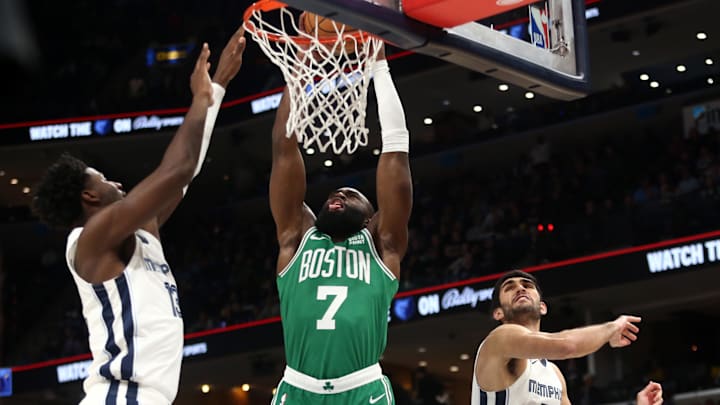 Nov 19, 2023; Memphis, Tennessee, USA; Boston Celtics guard Jaylen Brown (7) dunks over Memphis