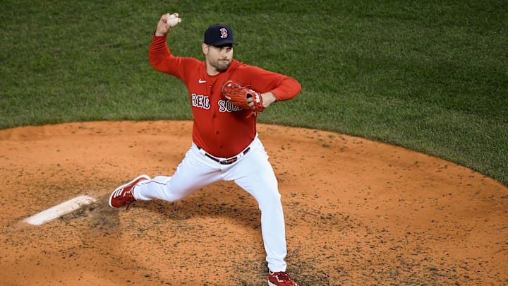 Oct 19, 2021; Boston, Massachusetts, USA; Boston Red Sox relief pitcher Adam Ottavino (0) pitches against the Houston Astros during the sixth inning of game four of the 2021 ALCS at Fenway Park. Mandatory Credit: Bob DeChiara-Imagn Images