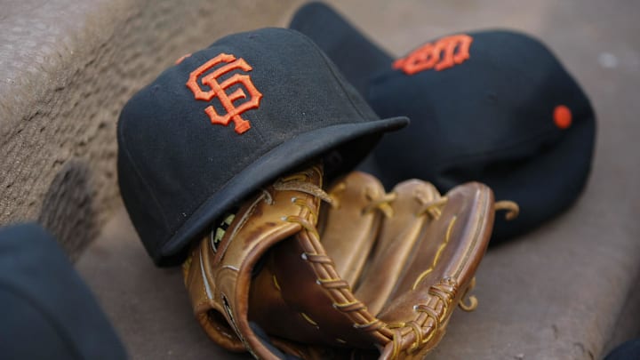 Aug 4, 2015; Atlanta, GA, USA; General view of a San Francisco Giants hat and glove in the dugout against the Atlanta Braves in the third inning at Turner Field.