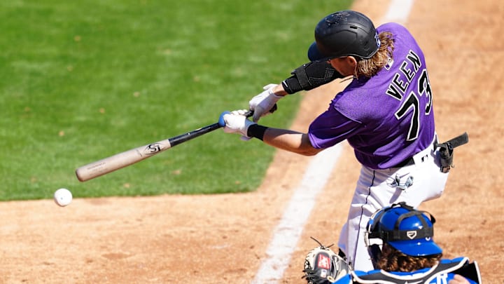 Mar 18, 2023; Las Vegas, Nevada, USA; Colorado Rockies right fielder Zac Veen (73) connects against the Kansas City Royals during the seventh inning at Las Vegas Ballpark.