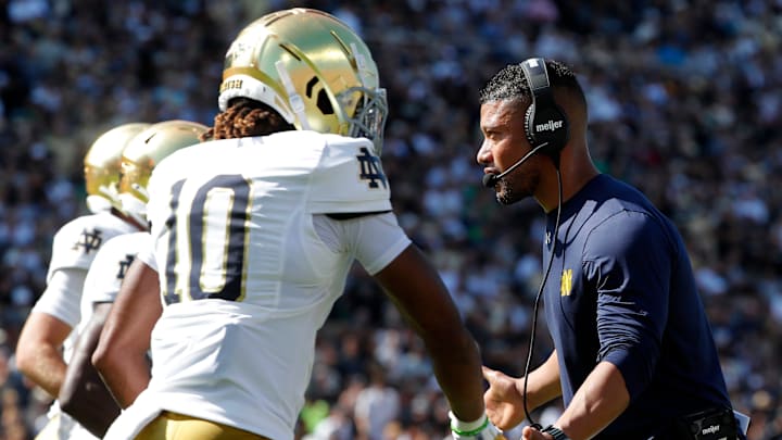 Notre Dame Fighting Irish head coach Marcus Freeman high-fives Notre Dame Fighting Irish wide receiver Kris Mitchell (10) Saturday, Sept. 14, 2024, during the NCAA football game against the Purdue Boilermakers at Ross-Ade Stadium in West Lafayette, Ind.