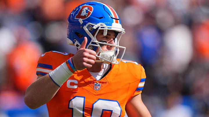 Oct 6, 2024; Denver, Colorado, USA; Denver Broncos linebacker Nik Bonitto (15) gives a thumbs up in the first quarter against the Las Vegas Raiders at Empower Field at Mile High. 