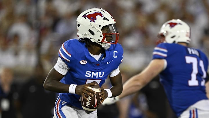 Sep 28, 2024; Dallas, Texas, USA; Southern Methodist Mustangs quarterback Kevin Jennings (7) in action during the game between the Southern Methodist Mustangs and the Florida State Seminoles at Gerald J. Ford Stadium. Mandatory Credit: Jerome Miron-Imagn Images