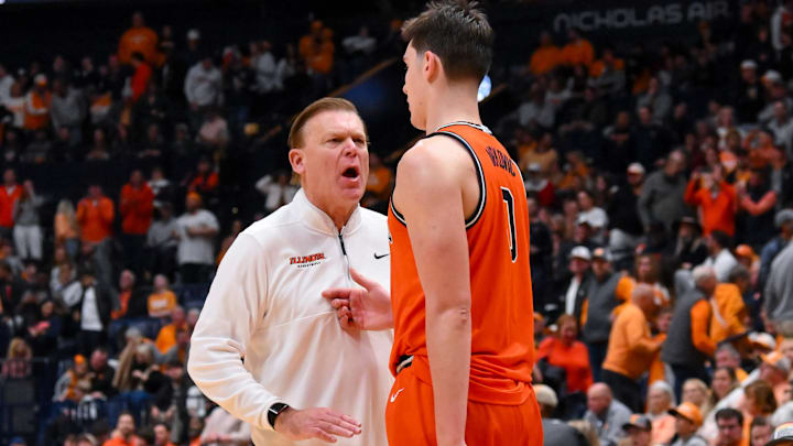 Dec 6, 2025; Nashville, Tennessee, USA;  Illinois Fighting Illini head coach Brad Underwood talks with forward David Mirkovic (0) against the Tennessee Volunteers during the second half at Bridgestone Arena. Mandatory Credit: Steve Roberts-Imagn Images