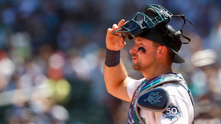 Jul 22, 2026; Seattle, Washington, USA; Seattle Mariners catcher Cal Raleigh (29) lifts up his mask between pitches against the Cincinnati Reds during the first inning at T-Mobile Park. Mandatory Credit: Joe Nicholson-Imagn Images Jul 22, 2026; Seattle, Washington, USA; Seattle Mariners catcher Cal Raleigh (29) lifts up his mask between pitches against the Cincinnati Reds during the first inning at T-Mobile Park. Mandatory Credit: Joe Nicholson-Imagn Images