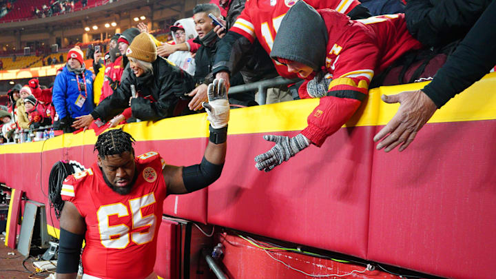 Jan 18, 2025; Kansas City, Missouri, USA; Kansas City Chiefs guard Trey Smith (65) greets fans while leaving the field after a 2025 AFC divisional round game against the Houston Texans at GEHA Field at Arrowhead Stadium. Mandatory Credit: Denny Medley-Imagn Images Jan 18, 2025; Kansas City, Missouri, USA; Kansas City Chiefs guard Trey Smith (65) greets fans while leaving the field after a 2025 AFC divisional round game against the Houston Texans at GEHA Field at Arrowhead Stadium. Mandatory Credit: Denny Medley-Imagn Images