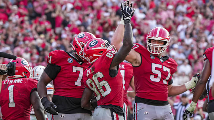 Oct 5, 2024; Athens, Georgia, USA; Georgia Bulldogs wide receiver Dillon Bell (86) reacts with offensive lineman Monroe Freeling (57) after catching a touchdown pass against the Auburn Tigers during the second half at Sanford Stadium. Mandatory Credit: Dale Zanine-Imagn Images