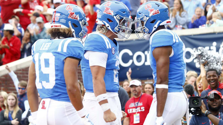 Sep 28, 2024; Oxford, Mississippi, USA; Mississippi Rebels quarterback Jaxson Dart (2) reacts with Mississippi Rebels wide receiver Tre Harris (9) after a touchdown during the second half against the Kentucky Wildcats at Vaught-Hemingway Stadium. Mandatory Credit: Petre Thomas-Imagn Images