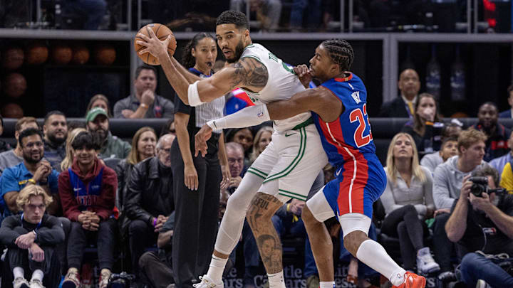 Oct 26, 2024; Detroit, Michigan, USA; Boston Celtics forward Jayson Tatum (0) protects the ball late in the second half from Detroit Pistons guard Jaden Ivey (23): David Reginek-Imagn Images