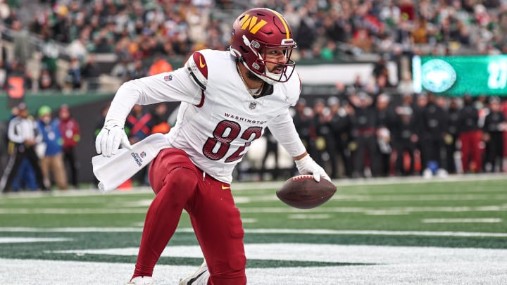 Dec 24, 2023; East Rutherford, New Jersey, USA; Washington Commanders tight end Logan Thomas (82) reacts after a touchdown reception during the second half against the New York Jets at MetLife Stadium. Mandatory Credit: Vincent Carchietta-USA TODAY Sports 