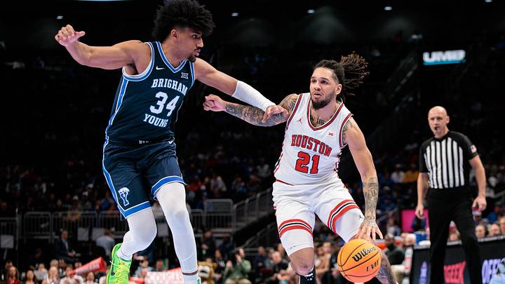 Mar 12, 2026; Kansas City, MO, USA; Houston Cougars guard Emanuel Sharp (21) brings the ball up court around BYU Cougars center Abdullah Ahmed (34) during the first half at T-Mobile Center. Mandatory Credit: William Purnell-Imagn Images Mar 12, 2026; Kansas City, MO, USA; Houston Cougars guard Emanuel Sharp (21) brings the ball up court around BYU Cougars center Abdullah Ahmed (34) during the first half at T-Mobile Center. Mandatory Credit: William Purnell-Imagn Images