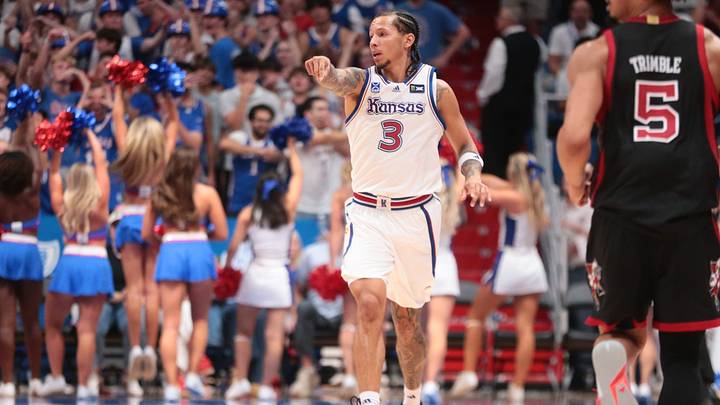 Kansas Jayhawks guard Tre White (3) points down after making a three against Louisville Cardinals during the exhibition game inside Allen Fieldhouse in Lawrence, Kansas on Oct. 21, 2026.