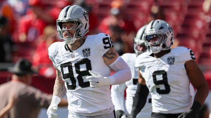 Dec 8, 2024; Tampa, Florida, USA; Las Vegas Raiders defensive end Maxx Crosby (98) takes the field for a game against the Tampa Bay Buccaneers at Raymond James Stadium. Mandatory Credit: Nathan Ray Seebeck-Imagn Images