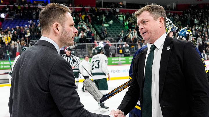 Michigan head coach Brandon Naurato, left, shakes hands with Michigan State head coach Adam Nightingale after 5-2 loss at the Duel in the D at Little Caesars Arena in Detroit on Saturday, February 7, 2026. Michigan head coach Brandon Naurato, left, shakes hands with Michigan State head coach Adam Nightingale after 5-2 loss at the Duel in the D at Little Caesars Arena in Detroit on Saturday, February 7, 2026.