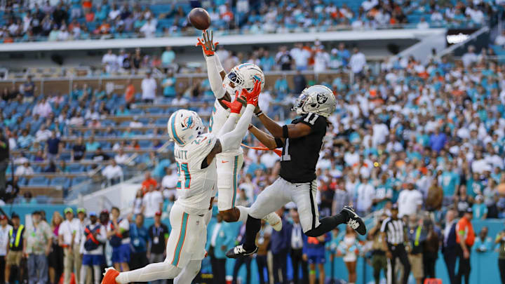 Miami Dolphins cornerback Jalen Ramsey (5) intercepts a pass intended to Las Vegas Raiders wide receiver Tre Tucker (11) during the fourth quarter at Hard Rock Stadium.