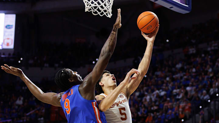 Jan 18, 2025; Gainesville, Florida, USA; Texas Longhorns forward Kadin Shedrick (5) shoots over Florida Gators center Rueben Chinyelu (9) during the first half at Exactech Arena at the Stephen C. O'Connell Center. Mandatory Credit: Matt Pendleton-Imagn Images Jan 18, 2025; Gainesville, Florida, USA; Texas Longhorns forward Kadin Shedrick (5) shoots over Florida Gators center Rueben Chinyelu (9) during the first half at Exactech Arena at the Stephen C. O'Connell Center. Mandatory Credit: Matt Pendleton-Imagn Images