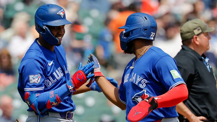 May 16, 2026; Detroit, Michigan, USA; Toronto Blue Jays first baseman Vladimir Guerrero Jr. (27) receives congratulations from right fielder Jesus Sanchez (12) after scoring in the third inning against the Detroit Tigers at Comerica Park. 