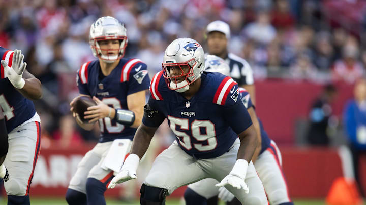 Dec 15, 2024; Glendale, Arizona, USA; New England Patriots offensive tackle Vederian Lowe (59) against the Arizona Cardinals at State Farm Stadium. Mandatory Credit: Mark J. Rebilas-Imagn Images