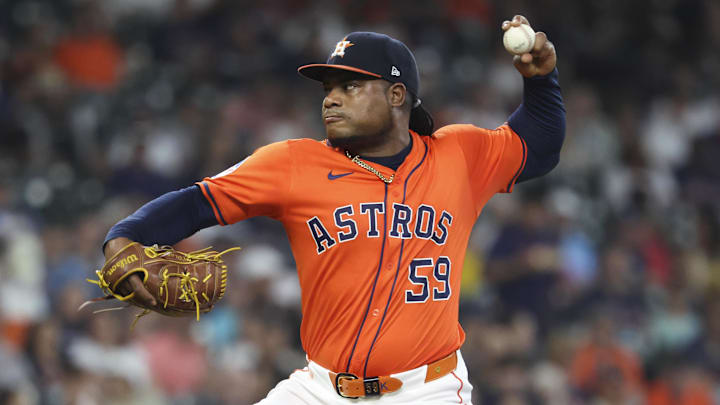 May 30, 2025; Houston, Texas, USA; Houston Astros starting pitcher Framber Valdez (59) delivers a pitch during the first inning against the Tampa Bay Rays at Daikin Park.