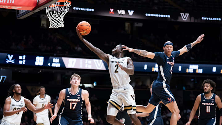 Vanderbilt guard Duke Miles (2) shoots for two points as Virginia guard Jacari White (6) guards him during the second half of their exhibition game at Memorial Gym in Nashville, Tenn., Thursday, Oct. 16, 2025.