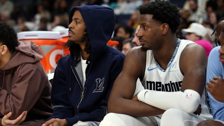 Jan 11, 2026; Memphis, Tennessee, USA; Memphis Grizzlies guard Ja Morant (left) and forward/center Jaren Jackson Jr. (right) looks on during the second quarter against the Brooklyn Nets at FedExForum. Mandatory Credit: Petre Thomas-Imagn Images