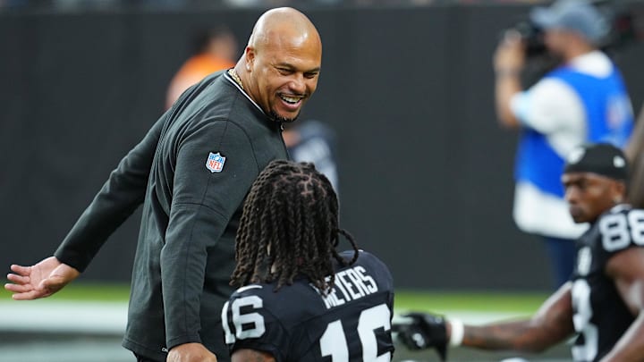 Oct 27, 2024; Paradise, Nevada, USA; Las Vegas Raiders head coach Antonio Pierce greets Las Vegas Raiders wide receiver Jakobi Meyers (16) before the start of a game against the Kansas City Chiefs at Allegiant Stadium. Mandatory Credit: Stephen R. Sylvanie-Imagn Images
