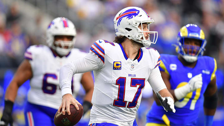 Dec 8, 2024; Inglewood, California, USA; Buffalo Bills quarterback Josh Allen (17) moves out to pass against the Los Angeles Rams during the first half at SoFi Stadium. Mandatory Credit: Gary A. Vasquez-Imagn Images