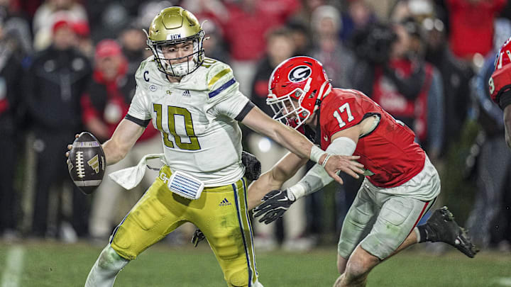 Nov 29, 2024; Athens, Georgia, USA; Georgia Bulldogs defensive back Dan Jackson (17) sacks Georgia Tech Yellow Jackets quarterback Haynes King (10) during overtime at Sanford Stadium. Mandatory Credit: Dale Zanine-Imagn Images