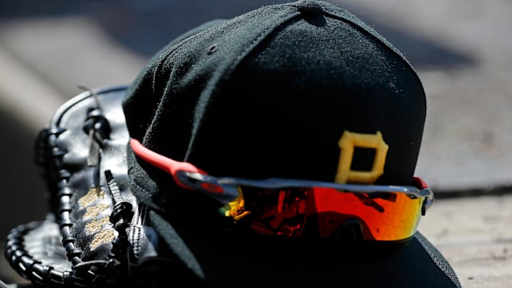 Apr 23, 2022; Chicago, Illinois, USA; A detail view of the glove, hat, and sunglasses of Pittsburgh