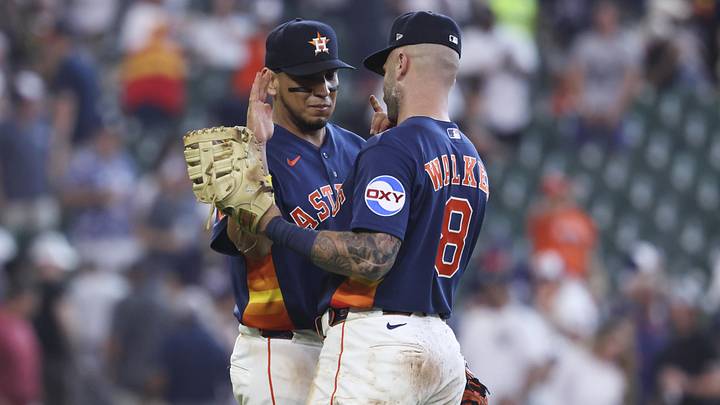 Houston Astros third baseman Isaac Paredes celebrates with first baseman Christian Walker.