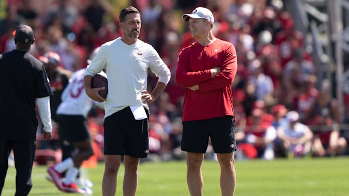 Jul 27, 2022; Santa Clara, CA, USA; San Francisco 49ers head coach Kyle Shanahan (left) and general manager John Lynch watches the players during Training Camp at the SAP Performance Facility near Levi Stadium. Mandatory Credit: Stan Szeto-Imagn Images