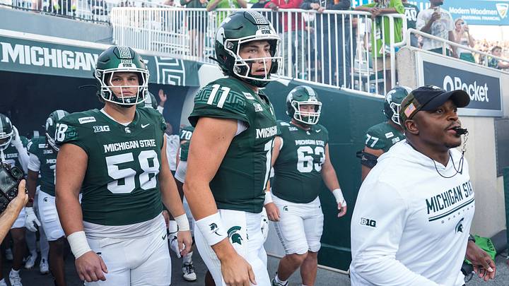 Michigan State players include quarterback Alessio Milivojevic (11) takes the field for practice ahead of the Toledo game at Spartan Stadium in East Lansing on Friday, Sept. 4, 2026. Michigan State players include quarterback Alessio Milivojevic (11) takes the field for practice ahead of the Toledo game at Spartan Stadium in East Lansing on Friday, Sept. 4, 2026.