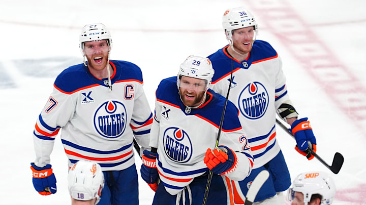 Edmonton Oilers center Connor McDavid (97) celebrates with center Leon Draisaitl (29) after the Oilers defeated the Vegas Golden Knights 1-0 during an overtime victory, completing a 4-1 series win during game five of the second round of the 2025 Stanley Cup Playoffs