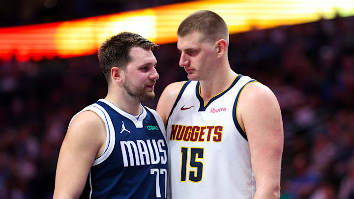 Mar 17, 2024; Dallas, Texas, USA;  Dallas Mavericks guard Luka Doncic (77) speaks with Denver Nuggets center Nikola Jokic (15) during the second half at American Airlines Center. Mandatory Credit: Kevin Jairaj-Imagn Images