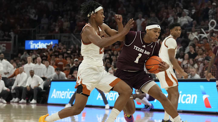 Jan 25, 2025; Austin, Texas, USA; Texas A&M Aggies guard Zhuric Phelps (1) drives to the basket against Texas Longhorns guard Tre Johnson (20) during the second half at Moody Center. Mandatory Credit: Scott Wachter-Imagn Images Jan 25, 2025; Austin, Texas, USA; Texas A&M Aggies guard Zhuric Phelps (1) drives to the basket against Texas Longhorns guard Tre Johnson (20) during the second half at Moody Center. Mandatory Credit: Scott Wachter-Imagn Images